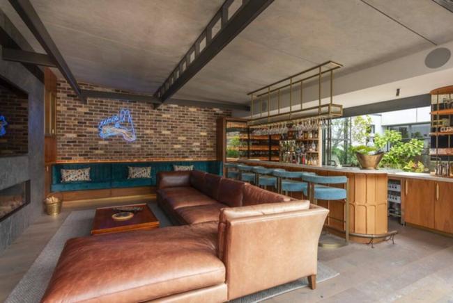 The penthouse includes a fully equipped cocktail bar.