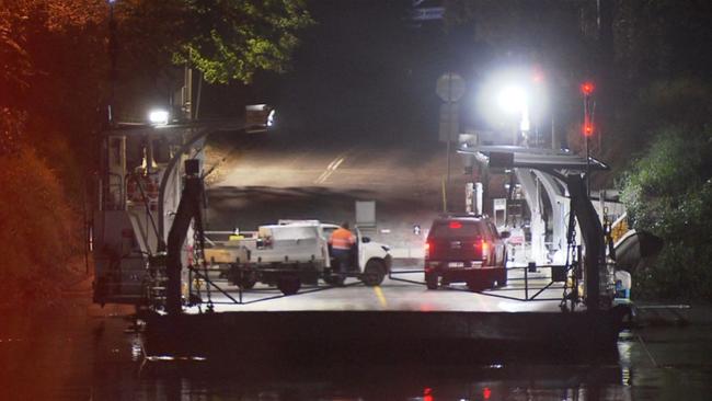 Emergency crews spend hours scouring the Brisbane River after a car was seen sinking near Moggill Rd Ferry.