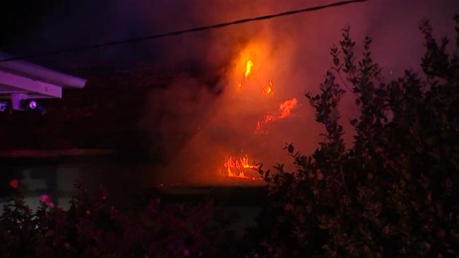 The house was engulfed in flames.